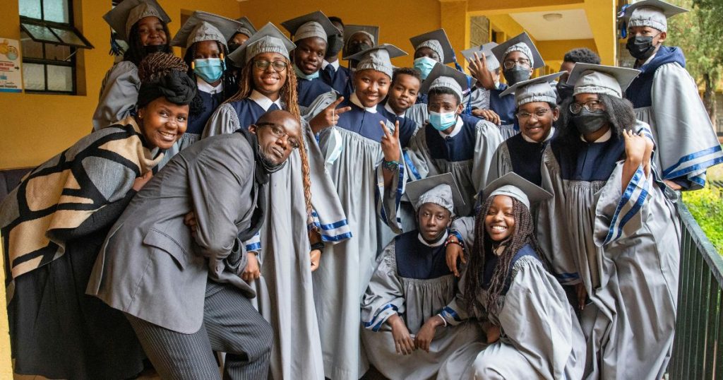 A group of diverse graduates in academic gowns celebrating their achievement, representing the impact of the Mastercard Foundation Scholarship in empowering young scholars.