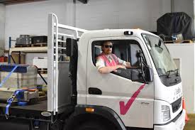 "Class 2 Delivery Driver position with Programmed in Taupo, New Zealand – showcasing a truck driver in high-vis gear beside a delivery vehicle, representing logistics and transportation work.